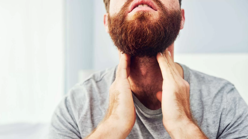 Man holding his throat and image used in relation to deep throating tips during blow jobs