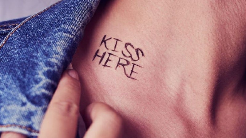kiss here written on neck