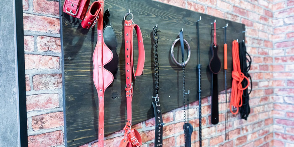 wall of BDSM toys, what is a bdsm contract