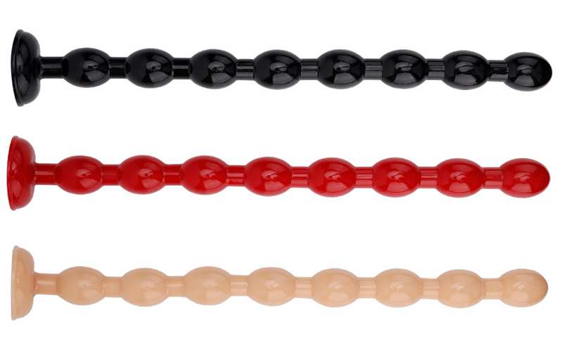 three long anal beads in black, red, and beige