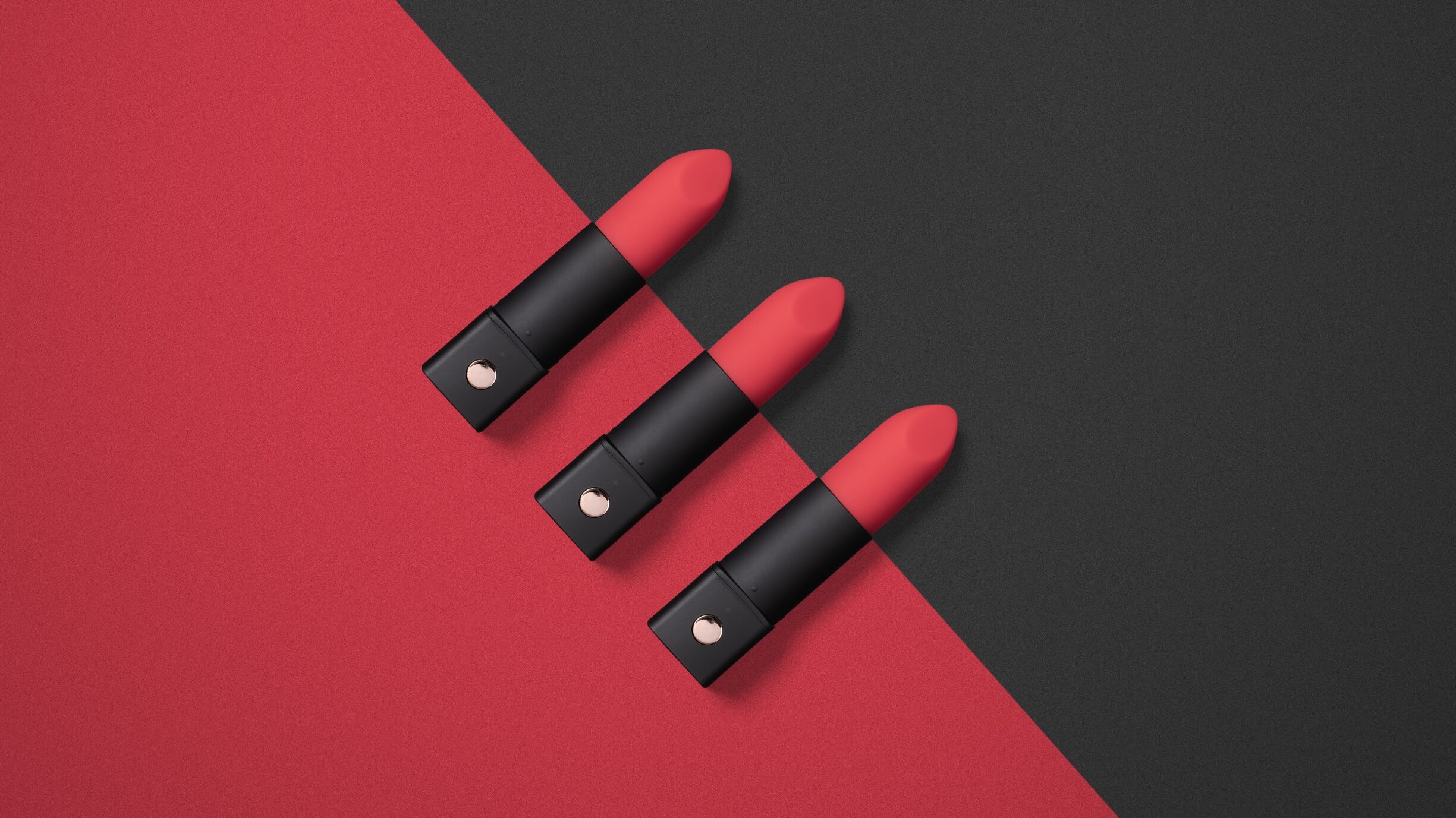 three lovense exomoons on black and red background, lipstick vibrators, bullet vibrators