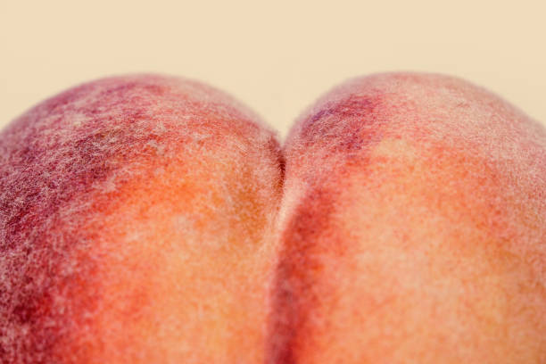 Alt: Up close photo of a peach resembling a butt