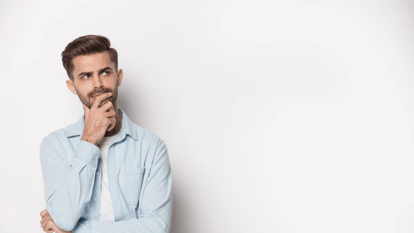 Alt: Handsome, cautious looking man