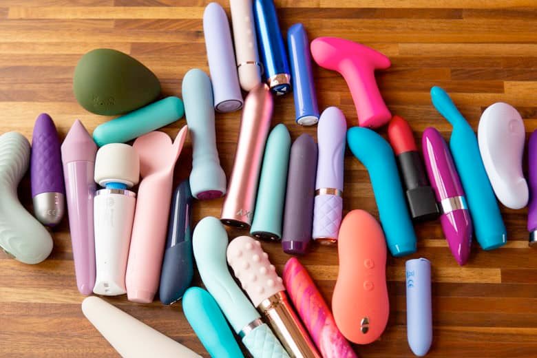 Alt text: Collection of lesbian vibrators on a table