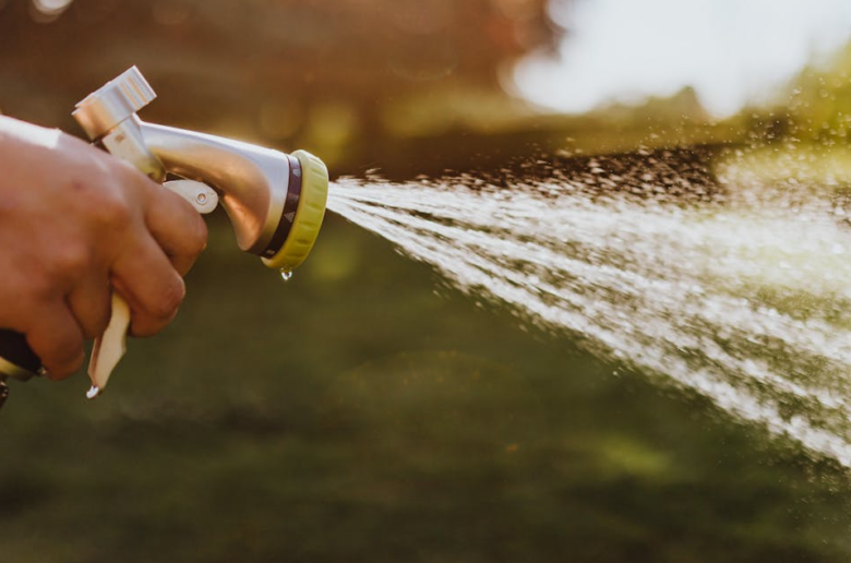 hand on spraying hose