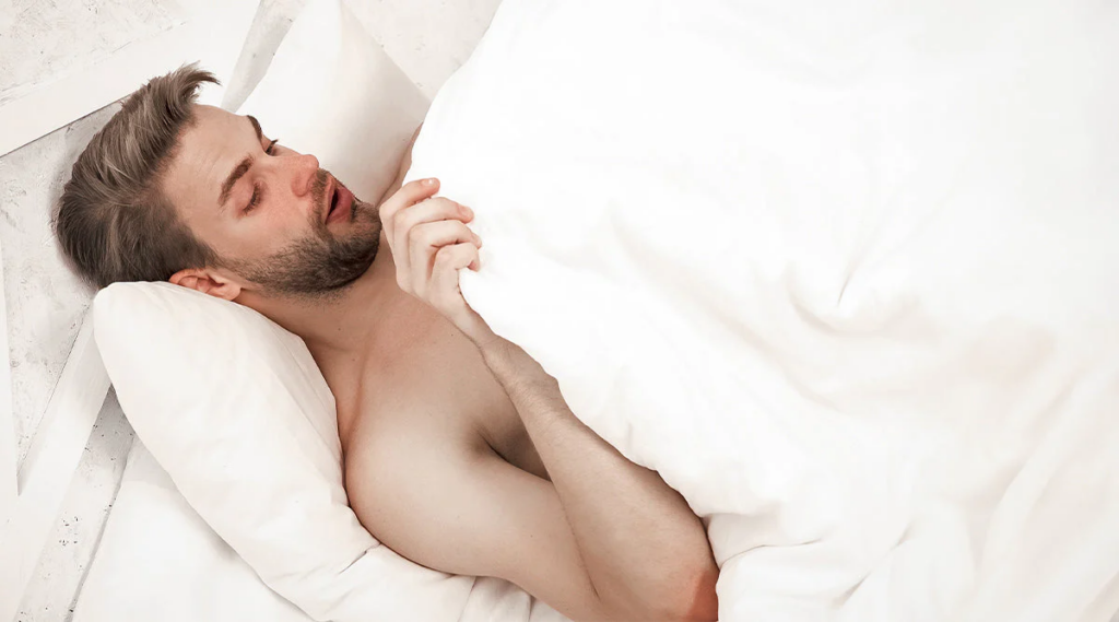 man looking undercovers surprised, delayed orgasm image