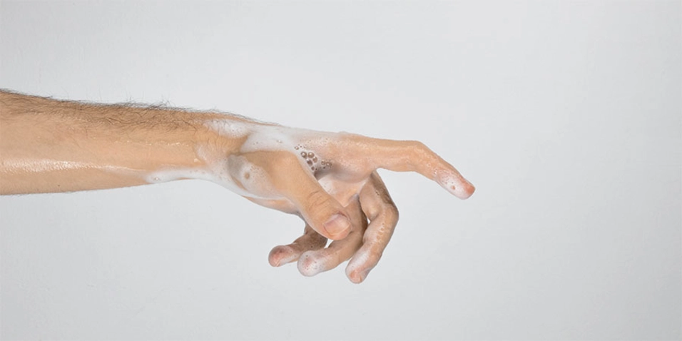 soapy hand pointing off screen