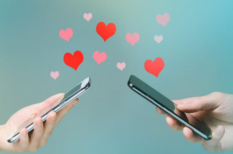 long-distance relationship sex toys and sex tech, two hands holding smartphones with hearts