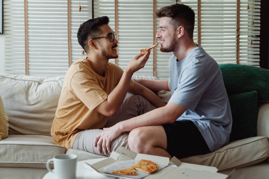gay couple eating pizza, love languages in relationships