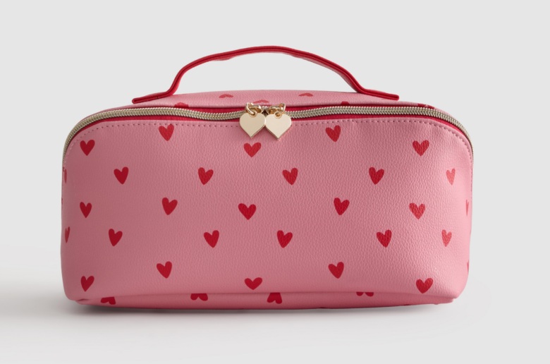 Make up bag with pink hearts for sex toy storage