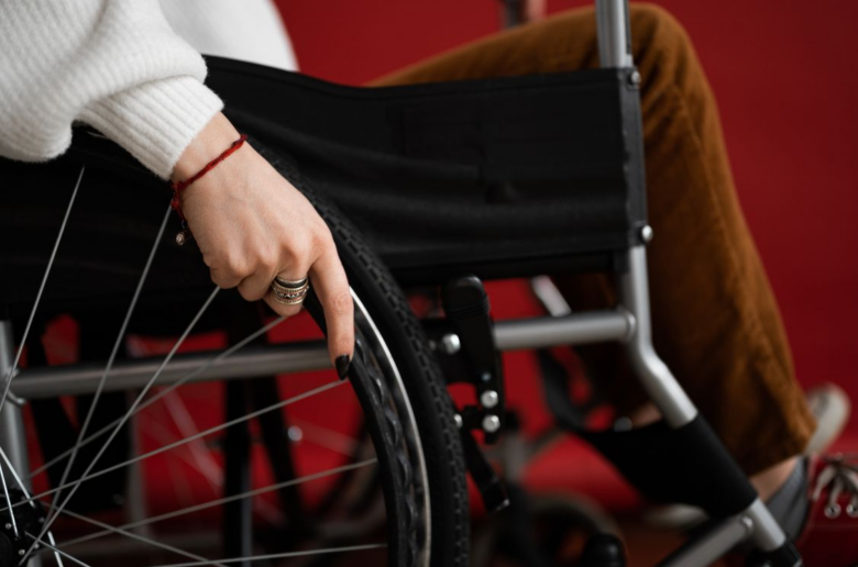 lower half of woman in wheel chair, cover image for adaptive sex toys for accessibility guide
