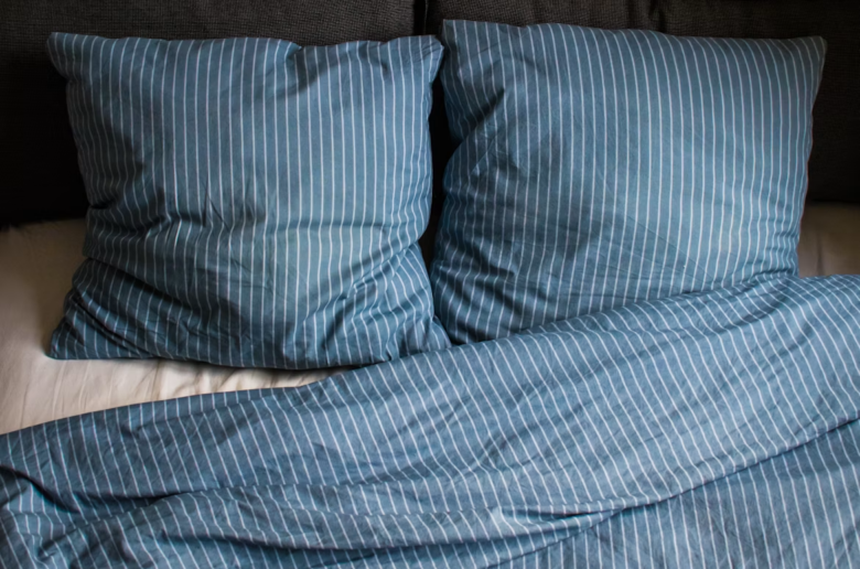 blue pillows on a bed, sex pillow article cover image