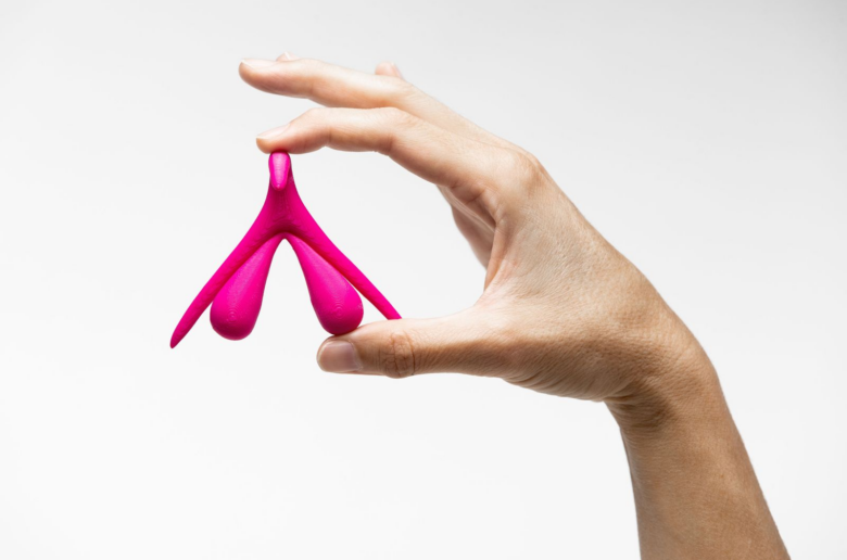 Hand holding a clitoris model